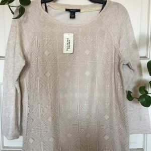 A brown long sleeve sweater